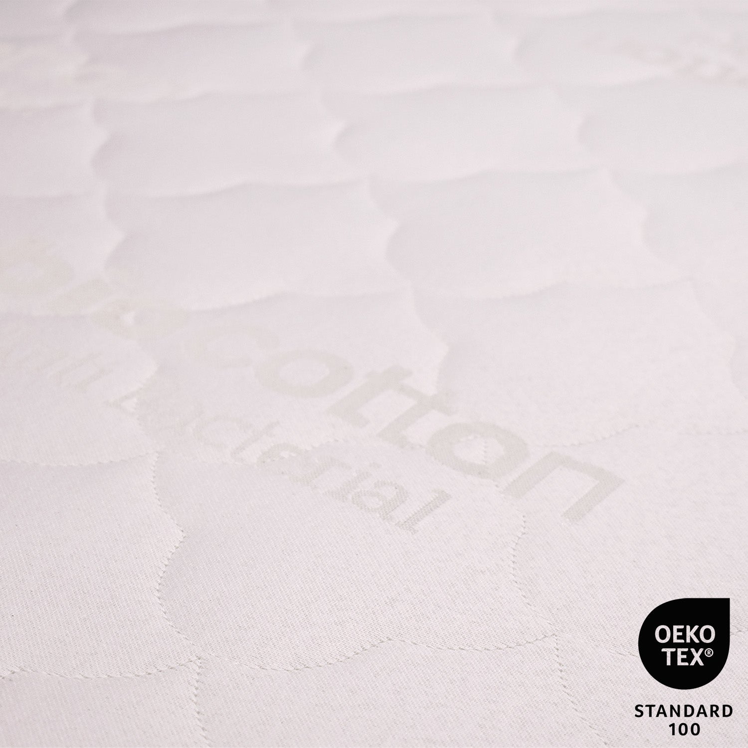 Close-up of a textured white fabric with 'Kotton' branding and OEKO-TEX Standard 100 logo.